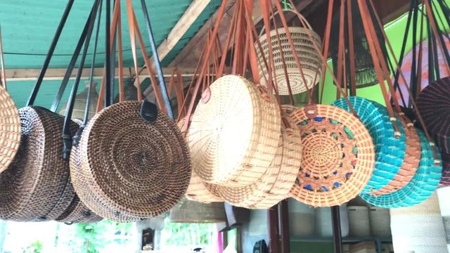 Rattan eco bags in the art shop on Bali island, Indonesia. Woman stylish eco bag.