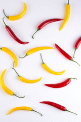 Colorful red and yellow  chili pepper background pattern on white