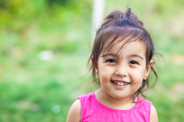 Happy cute asian girl outdoors. Summer time
