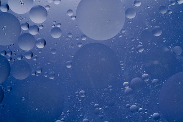 Water oil bubble macro abstract background flow liquid blue white aqua colors