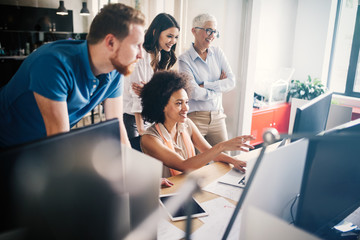 Group of successful business people at work in office