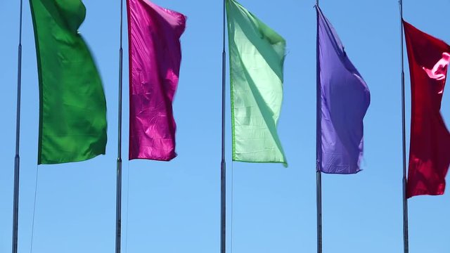multi colors plain flags on blue sky background