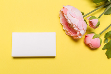 Blank white business cards on yellow background. Mockup for branding identity.