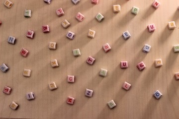 Fototapeta na wymiar Random color and position of alphabet plastic cube