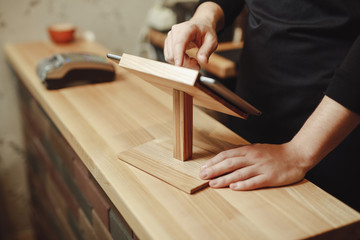 Barista working at the bar with tablet PC for best online maintenance, closeup