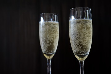 Champagne glass on wooden background