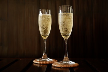 sparkling wine on wood background