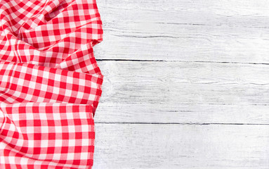  Red checkered tablecloth on wooden table
