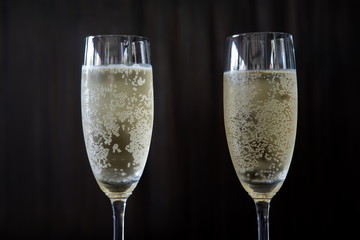 Champagne glass on wooden background