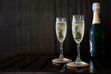 Champagne glass on wooden background