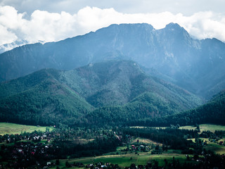 Fototapeta na wymiar Beautiful view of villages on a hill and mountains in Zakopane, Poland, Europe.