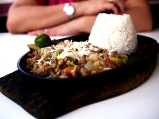 Freshly cooked Sisig on a hot plate