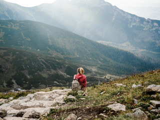 Girl on the top of Tatras Mountains far away in Poland and Slovakia, View of a girl hiking to Slovakian mountains high alone in summer.