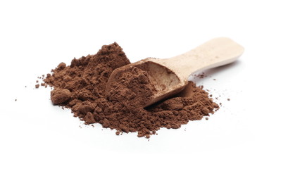 Cocoa powder with wooden spoon isolated on white background