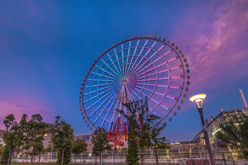 Odaiba illuminated Palette Town Ferris wheel named Daikanransha visible from the central urban area...