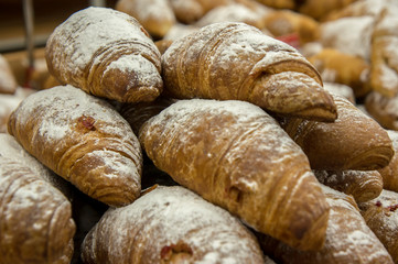 many fresh croissants background
