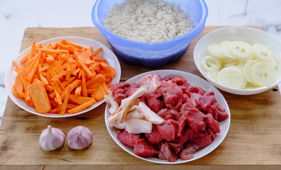 meat, rice, carrots, onions, garlic for pilaf