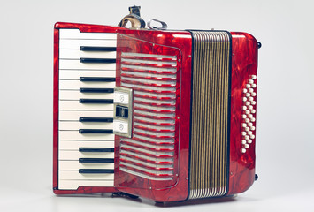 Vintage accordion against a white background