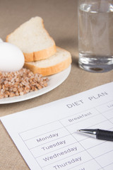 Notebook with buckwheat,bread,eggs and water