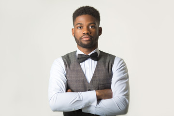 stylish african man in a waistcoat on a white background