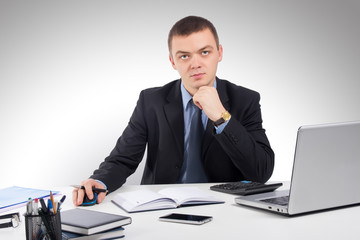 Business man working with documents and laptop