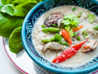 Salted crab stew with coconut milk, minced pork served with vegetables, Thai food.