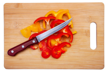 Red and yellow peppers cut into thin slices.