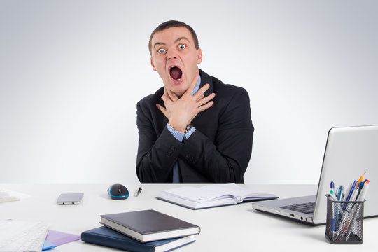 Business, people, time management and office concept -Businessman tries to strangle himself to despair.Concept of problems and solutions