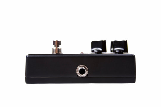 Black guitar effect pedal input - side input view, isolated on white background