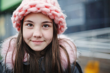 Close up portrait of young teen girl smiling outdoor.