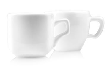 the two white coffee cups isolated on white