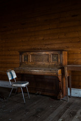 Chair and Piano at abandoned town hall, Tasmania