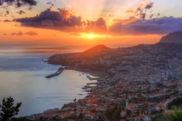 Beautiful skyline cityscape aerial view from the hill of the city Funchal on the island Madeira at sunset in summer