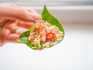 Close up, Close-up Thai-Style Savory Leaf Wraps (Miang Kham) a traditional snack from Thailand and Laos, introduced to Siamese court, Name Miang Kham