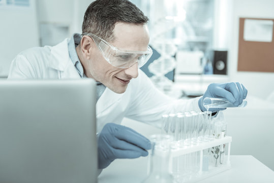 Researcher wearing layer of protection during experiment