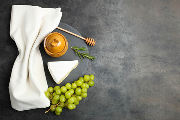 white Camembert cheese with honey and white grapes