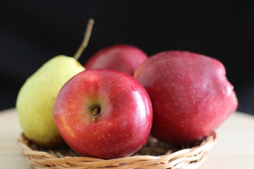 Yellow pear and red apples