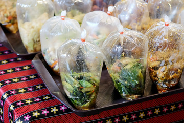 Thai prepared food in clear plastic bag for taking home, popular food style for new generation...