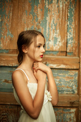 Naklejka premium Photo of a teenager girl surrounded by countryside.