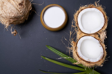 coconut with coconut milk on black table