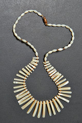 Beautifull nacre necklace on  black textured wooden table