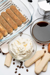 Ingredients for making traditional italian cake tiramisu on white background