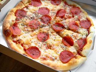 Close Up Italian Recipe Hot Homemade Pepperoni Pizza Ready to Eat, Delivery served in a box, Close Up. 