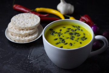 Pumpkin asian coconat cream soup. Autumn hot food