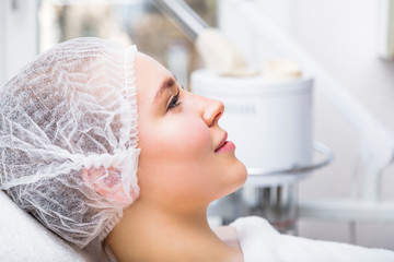Obraz na płótnie Canvas Woman waiting for procedure in beauty salon