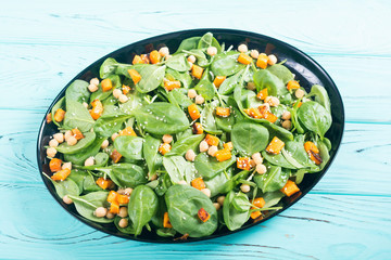 autumn salad with pumpkin , spinach , chickpea and sesame