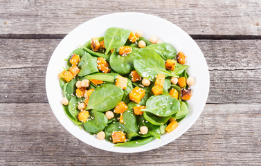 autumn salad with pumpkin , spinach , chickpea and sesame