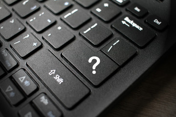 Enter button on laptop keyboard with question mark. Enter keyboard key button on a computer. Close up of Enter key of Laptop computer. question mark