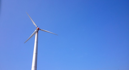 wind turbine against blue sky