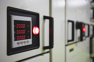 Electrical switch gear at Low Voltage motor control center cabinet  in coal power plant. blurred for background.